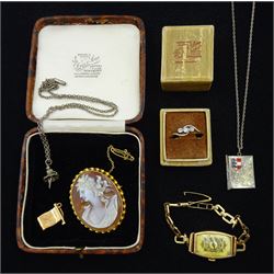 Early 20th century 15ct gold three stone old cut diamond crossover ring, gold cameo brooch, gold ladies manual wind bracelet wristwatch and flag charm, all 9ct, silver ballerina pendant necklace and one other necklace