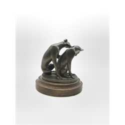 Patinated bronze sculpture of two Whippets on oval base, mounted on stepped plinth, H9cm