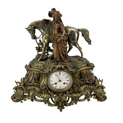 French - 19th century brass cased 8-day mantle clock surmounted with a figure of a lady in 18th century dress leading a horse, with a white enamel dial, Roman numerals and steel moon hands, twin going barrel movement with rack striking on a bell. With pendulum. 
