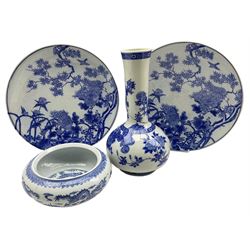 Pair of late 19th century Japanese blue and white chargers decorated with trees and birds D34cm, a Japanese blue and white vase H34cm and a 20th century Chinese blue and white bowl D14cm (4)