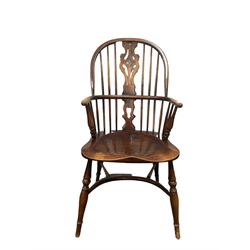 Ash and elm Windsor armchair, the splat and spindle back over elm seat, raised on turned supports, united by stretchers  