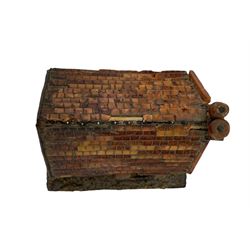 18th century North European amber and tortoiseshell model of a half-timbered, two storey farmhouse, with tiled roof, mother-of-pearl sundial placed beneath the chimney stack and steps leading to the front door, mounted upon a grit-covered rectangular base, H10cm x W10cm