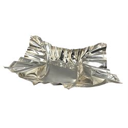 Novelty silver dish by Rebecca Joselyn modelled as a crumpled crisp packet 22cm x 17cm, hallmarked Sheffield 2013. Rebecca Joselyn studied at Sheffield Hallam University and graduated in 2006. She has won numerous awards for her 'From the Shed' and 'Packaging' collections