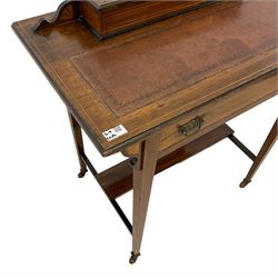 Late Victorian rosewood writing desk, the rectangular moulded top with leather inset surmounted by hinged compartment with pen rest and document divisions, inlaid with fan motifs and urn with extending scroll foliate, fitted with single frieze drawer, on square tapering supports joined by rectangular under tier, brass and ceramic castors, box wood stringing throughout 