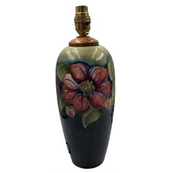 Moorcroft Clematis pattern table lamp, of ovoid form with graduated turquoise and blue ground, impressed 'Potter to H.M The Queen' and blue signature, H33cm overall