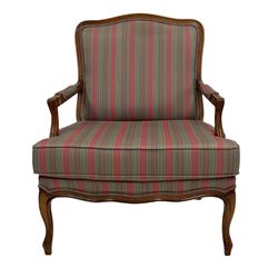 French style armchair, upholstered in stripe fabric, raised on cabriole supports 