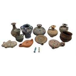 Three Roman style terracotta oil lamps, two blue stone figures of Anubis, together with similar vases and vessels (13) 