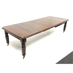 Large late 20th century Victorian style dining table, the moulded rounded rectangular top on pull out action base, turned and reeded supports on castors, three additional leaves, H72cm, 125cm x 150cm - 311cm, 10' 2'' (fully extended)