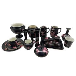 Collection of Carlton Ware items decorated with pink blossom on a black ground including dressing table pieces, two jardinieres, vases etc (20)