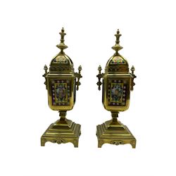 Late 19th century continental brass cased striking mantle clock with a pair of matching brass framed casolets, polished brass case with a deep recessed pediment surmounted by a pierced gallery and arched top with inset floral panels and brass finial, reeded columns to the front on a shaped plinth with applied decoration, rectangular enamel and hand painted porcelain dial on a yellow ground within a floral cartouche, Arabic numerals and a depiction of three convivial gentlemen in 18th century costume, conforming porcelain side panels depicting Germanic Rhineland castles, with an eight-day rack-striking Parisian movement by Japi Freres, striking the hours and half-hours on a bell.  With pendulum & Key.
Clock H42  W21  D14   Casolets H38

