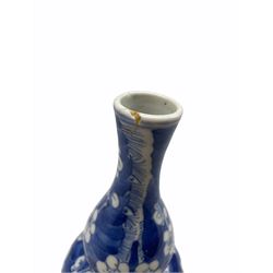 19th/ early 20th century Chinese gourd shape vase decorated with prunus in blue and white with four character mark to base, H21cm 