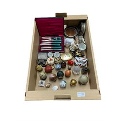 Porcelain trinket boxes, Cloisonne, stone, glass and other Eggs, three silver-plated bottle coasters, set of tea knives etc in one box