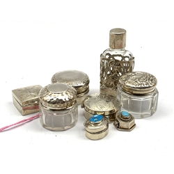 Three small silver pill boxes, two glass jars with silver covers, glass scent bottle with silver case and two small pill boxes with turquoise covers