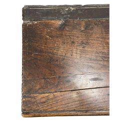 17th/18th century boarded or plank chest, hinged lid enclosing candle box, with incised edge decoration, on bracket end supports 
