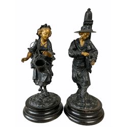 Pair of spelter figures modelled as a wine seller and companion figure with gilded highlights, H33cm max