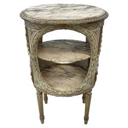 Late 20th century French style three-tier stand or lamp table in painted finish, the oval top with white, pale orange and black veined marble top, the rim carved with repeating geometric design, oval apertures carved with laurel leaf garlands, fitted with two marble shelves, cane work sides with applied foliate garlands, turned and fluted supports