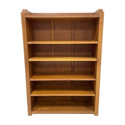 Mouseman - oak open bookcase, solid end supports with curved front corners, carved with mouse signature, with four adjustable shelves, by Robert Thompson of Kilburn