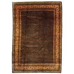 Arrak indigo ground rug, the field decorated with small repeating Boteh motifs, multiple band border, the main band with trailing pattern decorated with small stylised motifs