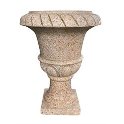 Polished granite Campana shaped garden urn on base, cavetto edge over carved egg and dart decoration