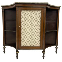 Early 20th century Regency Revival mahogany side cabinet, rectangular form with concaved ends, green marbled finish top over central cupboard enclosed by grille and fabric panelled door, with turned simulated ivory handles, flanked by concaved shelves, mounted by brass beading, on turned tapering feet 
