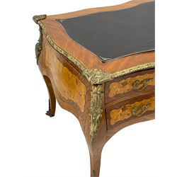 Louis VX style Kingwood and walnut bombe shaped desk, serpentine top with inset and foliate cast gilt metal edging, fitted with five drawers, decorated with scroll foliate and shell cartouche mounts, shaped figured inlaid panels