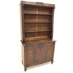 19th century mahogany bookcase on cupboard, three open shelves with beaded moulding, enclosed by scroll carved water leaves, over two fielded panelled cupboard doors enclosing one shelf, raised on lobe carved and turned supports, W103cm, H190cm, D41cm