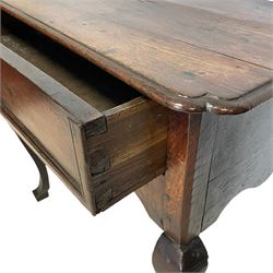 18th century oak lowboy, the moulded top with shaped front corners over frieze drawer with applied mouldings, shaped apron and side rails, on angular cabriole front supports