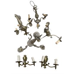 Various brass chandeliers and wall lights
