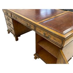 Large Georgian style figured walnut desk, moulded reverse breakfront top with three sectional inset leather top, cushion frieze, fitted with nine drawers to one side, and two cupboards to the other, on ogee bracket feet