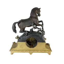 French - early 19th century 8-day mantle clock c1820, with a gilt spelter and alabaster base surmounted by a simulated bronze horse,  white enamel dial with Roman numerals and pierced gilt hands, count wheel striking movement with a silk suspension, striking the hours and half hours on a bell. 