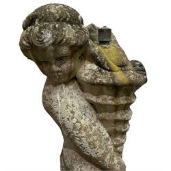 Weathered cast stone garden statue water feature, in the form of a child holding a spouting shell
