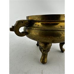 19th century Chinese two handled brass censer, the rim and handles with engraved decoration on triple demon mask supports D15cm