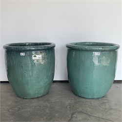  Two green glazed terracotta egg cup planters, D50cm  