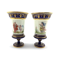 Pair of 19th century Sevres style porcelain vases, each hand painted with classical figures in a landscape within jewelled and gilt borders on cobalt blue ground, H20.5cm