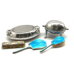 Mappin & Webb silver plated two-handled revolving breakfast dish with engraved decoration, silver-plated entrée dish, silver and blue guilloche enamel brush and hand mirror by Daniel Manufacturing Company, Birmingham, 1948 and an Edwardian silver backed brush (5)