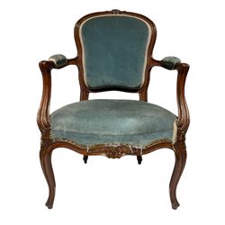 Early 20th century French style walnut open armchair, the moulded cresting rail carved with flower heads, upholstered in blue fabric, scroll carved arm terminals and cabriole supports