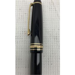 Mont Blanc Meisterstuck fountain pen, black lacquer body with gilt bands and clip, inscribed 'Montblanc-Meisterstuck' with 14kt white and yellow gold nib, numbered 4810 together with a Parker Moderne (Duette Junior) fountain pen with 14k gold nib, made in Canada (2)