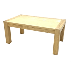 Contemporary solid light oak coffee table, rectangular supports raised on square supports 