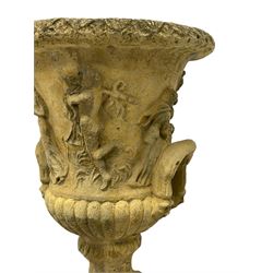 Pair of composite stone classical design urns, campana shape with relief frieze depicting the Muses, on square pedestal base