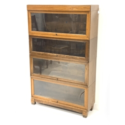 20th century oak 'Globe Wernicke' stacking library bookcase, four tiers enclosed by glazed doors, W85cm, H137cm, D29cm