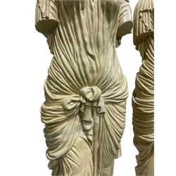 Pair Greek style caryatid columns, square top with gadroon underbelly, the semi-nude female figure draped in tied robe, circular stepped plinth base 