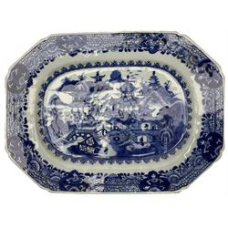 18th century Chinese Export blue and white serving dish, of rectangular canted form, decorated with scenes of peonies and other flowers amid rockwork in a fenced garden L26.5cm, and two similar examples, the first decorated with a river landscape and the second with pagodas in a mountainous landscape, largest L29cm (3)