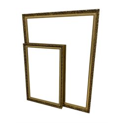 Large rectangular wall mirror with foliate patterned gilt frame and bevelled plate; with matching smaller mirror 