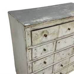 Late 20th century painted pine multi-drawer chest, fitted with fifteen drawers