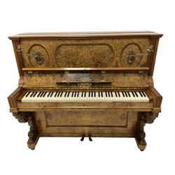 L. Neufeld Berlin - late 19th century burr walnut cased upright piano, over strung iron frame with an over damper action serial no. 4988, fluted uprights flanking oval panels with gilt metal candle sconces, the lower supports carved with scrolls and acanthus leaves.