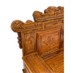 Chinese Imperial style hardwood throne room settee or sofa, the triple panelled back carved with dragon masks and birds in naturalistic landscapes, uprights fitted with two small drawers, on block supports, carved with scrolling foliate and traditional Chinese motifs