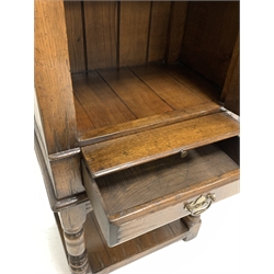 Titchmarsh and Goodwin oak drinks cabinet, fitted with arched panelled door over slide and one drawer, raised on turned supports united by under tier, 