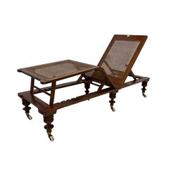 19th century mahogany and cane work campaign bed, with green squab cushion, adjustable seat, back and leg rest, on turned feed with brass cups and ceramic castors