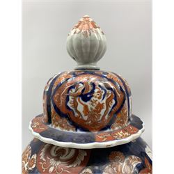 Japanese Imari baluster form vase with cover decorated in the typical palette together with another depicting traditional scenes max H32cm
