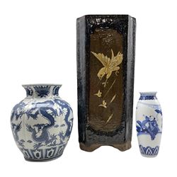 Chinese blue and white Dragon vase of lobed form, another Chinese blue and white vase and an Oriental stoneware stick stand decorated with panels of Eagles and Cranes, H44cm 